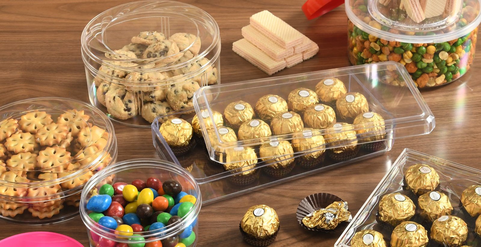 Clear PS containers holding cookies and chocolates
