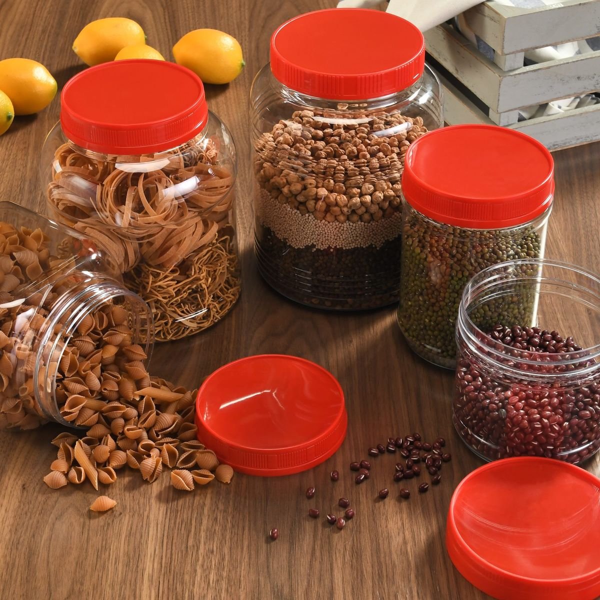 PET jars with red caps holding nuts and beans