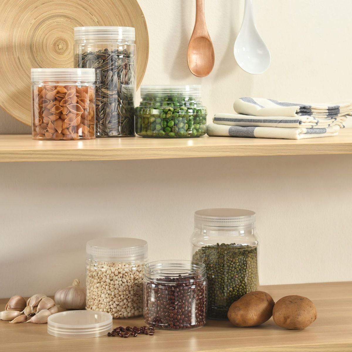Jars of dry food on kitchen shelves