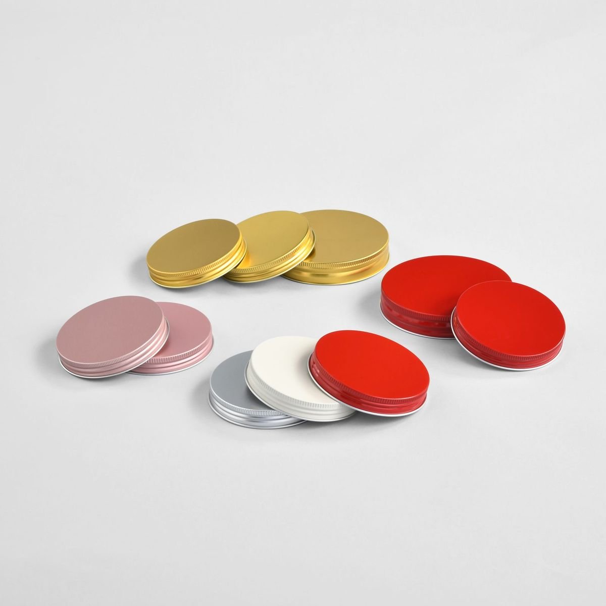 Gold, silver and red aluminium caps